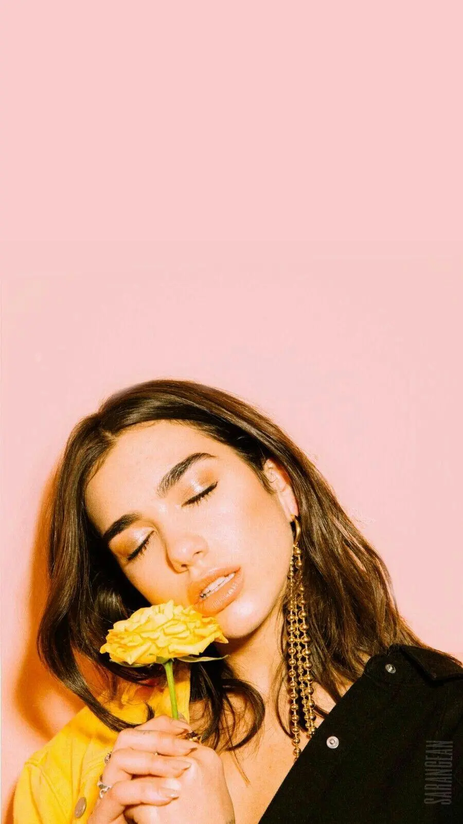 Wallpaper of Dua Lipa with multiple singing honors