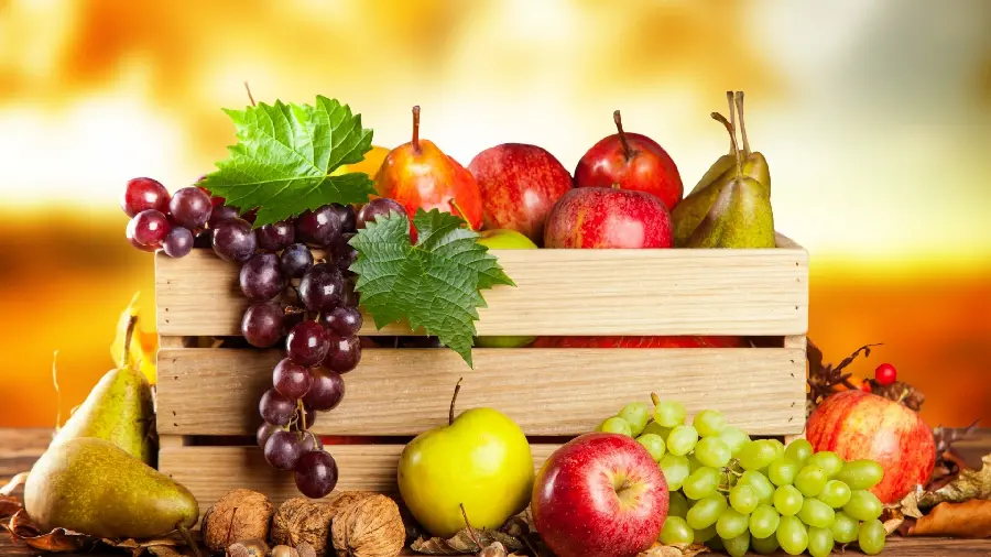 Download stock image of a box full of delicious and colorful fruits 