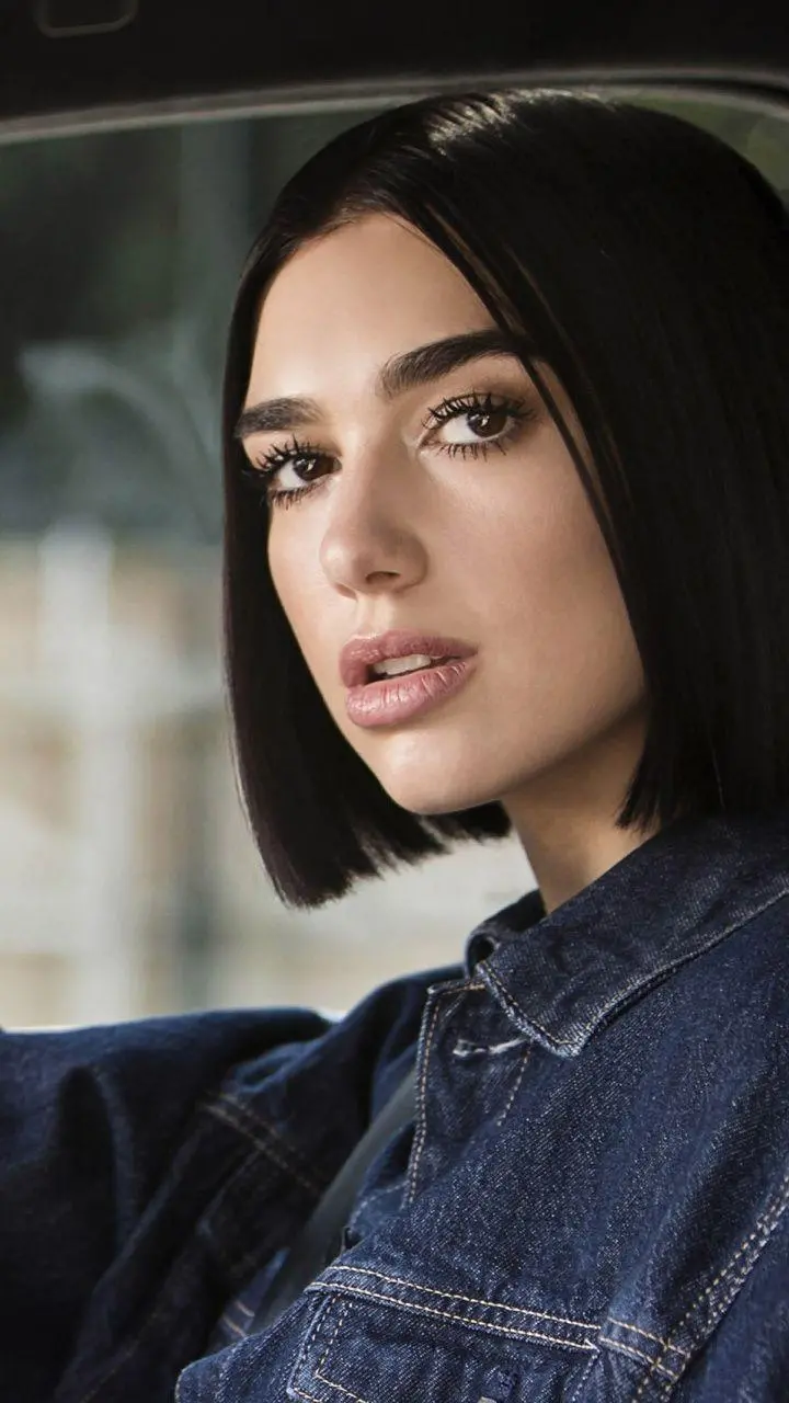 Wallpaper of Dua Lipa with short black hair with direct link 