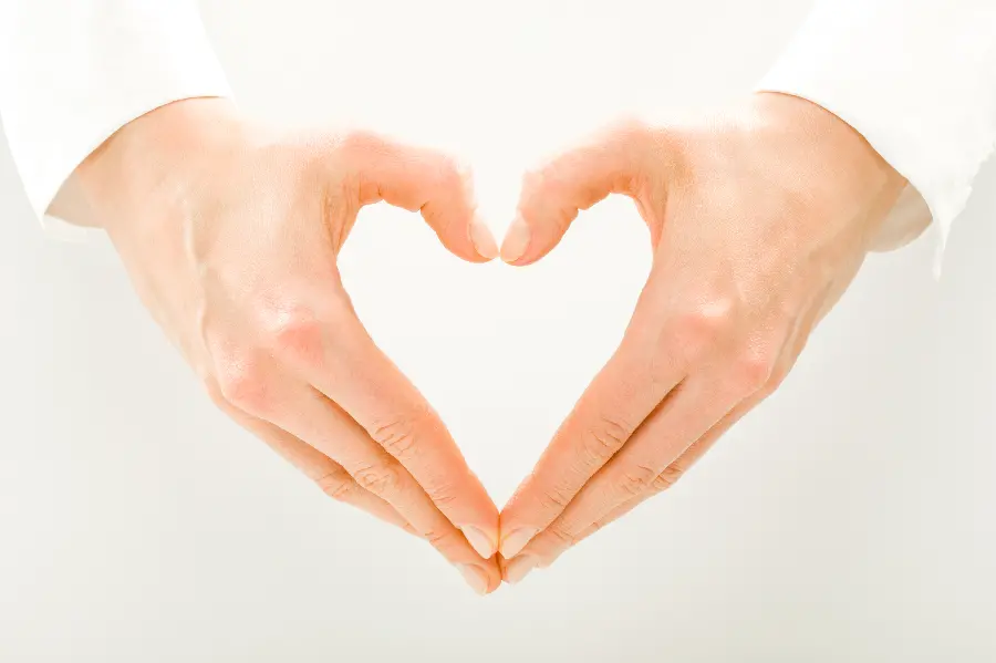 Attractive image of a hand made heart to express love on Valentine's Day between couples