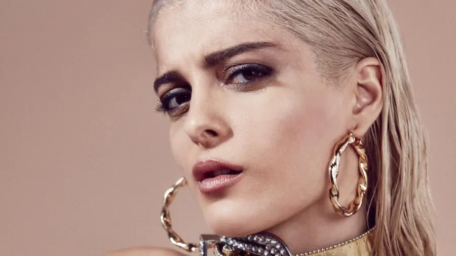 Bebe Rexha serious and frowning 