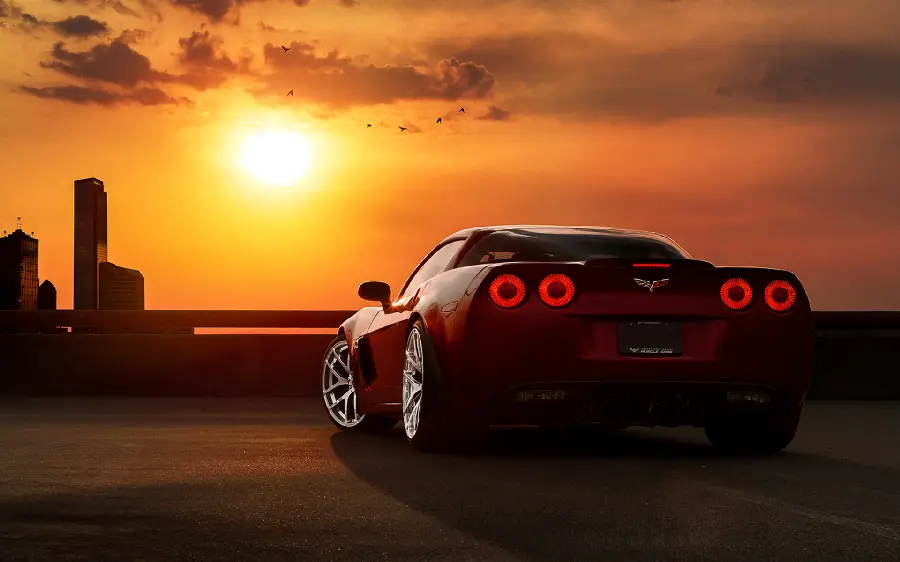 Stylish and Classy Wallpaper of Luxury Chevrolet Car in Sunset Background