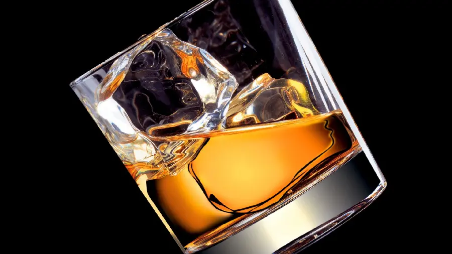 Download laptop background photo of a glass of drink With a black background 