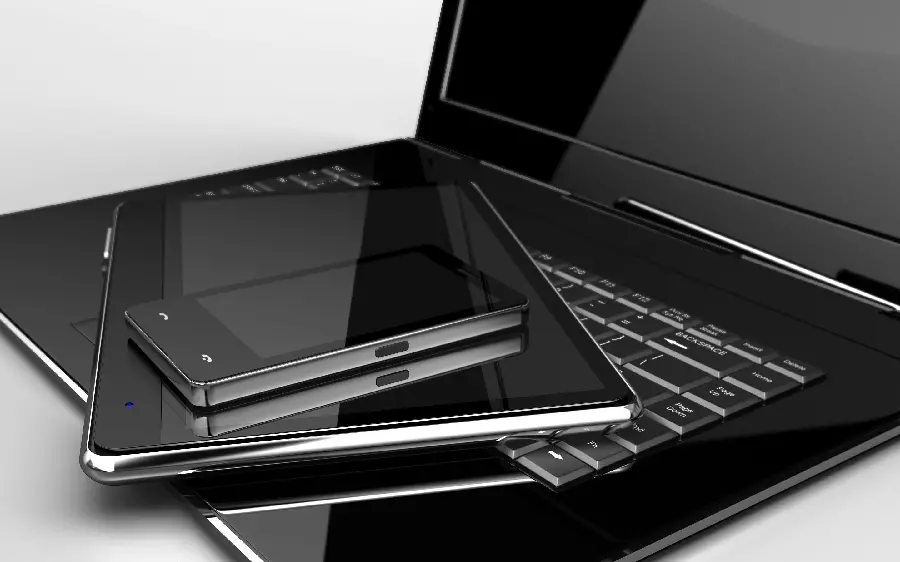 Stock image of a business laptop and tablet on a white background