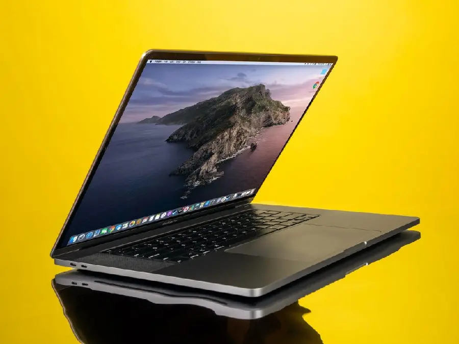 Business Stock Image of Apple Laptop on Yellow Background