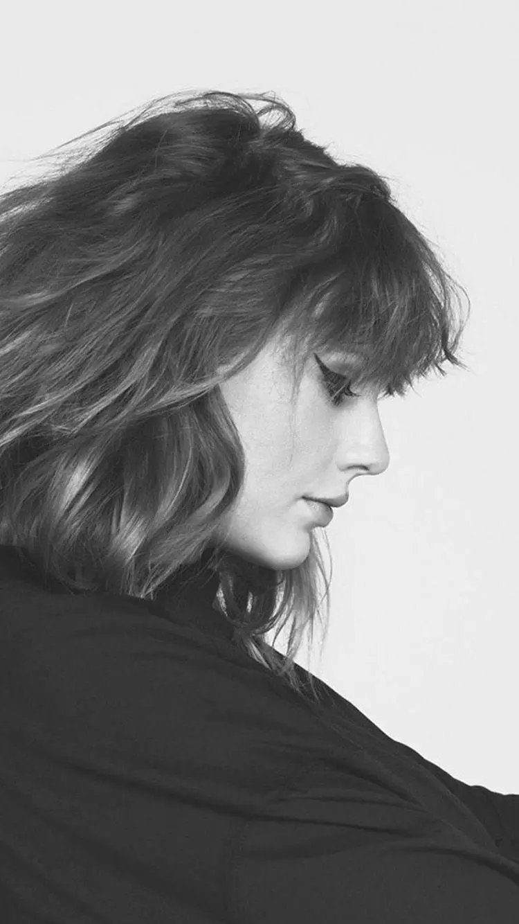Black and white image of Taylor Swift's 34-year-old face profile