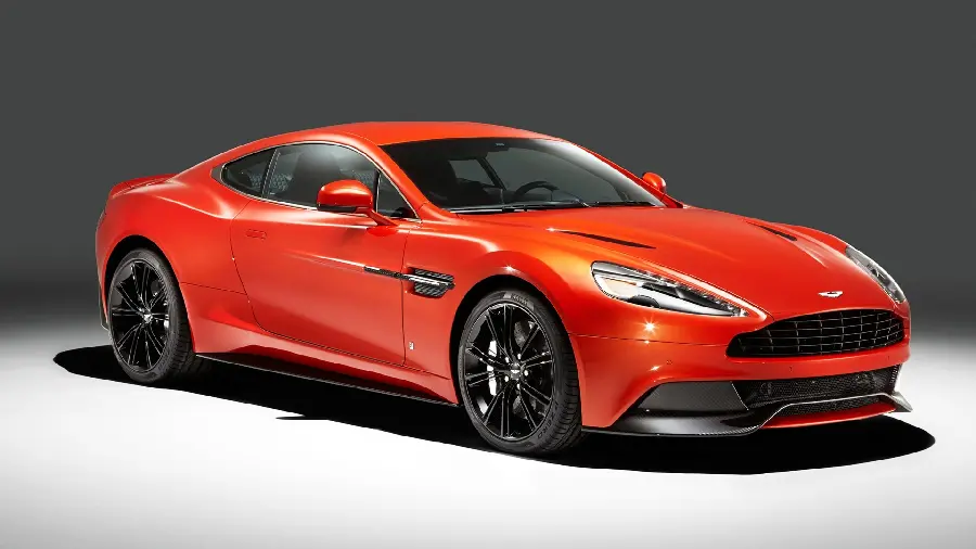 Photo of a red Aston Martin luxury car on a plain background