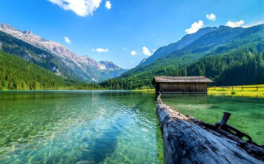 A charming and spectacular picture of a lake full of mountain water in a forest with high quality 