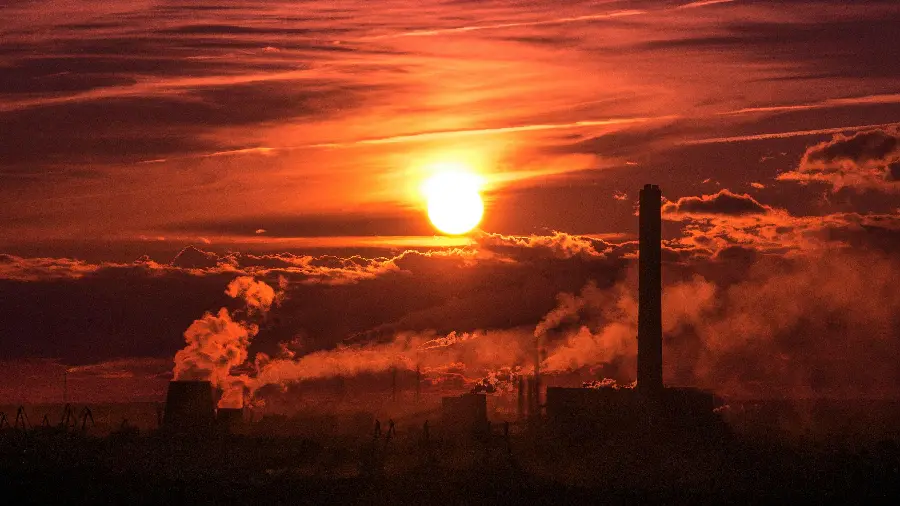 Image of metallurgical engineering factory in the background of the sunset