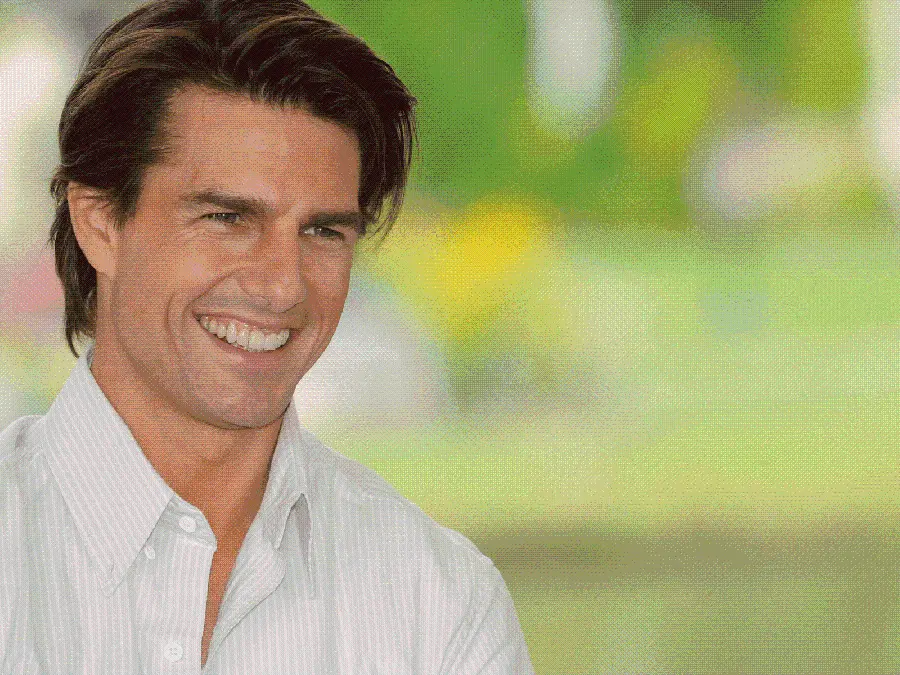 Background photo of Tom Cruise with a faded and blurred background
