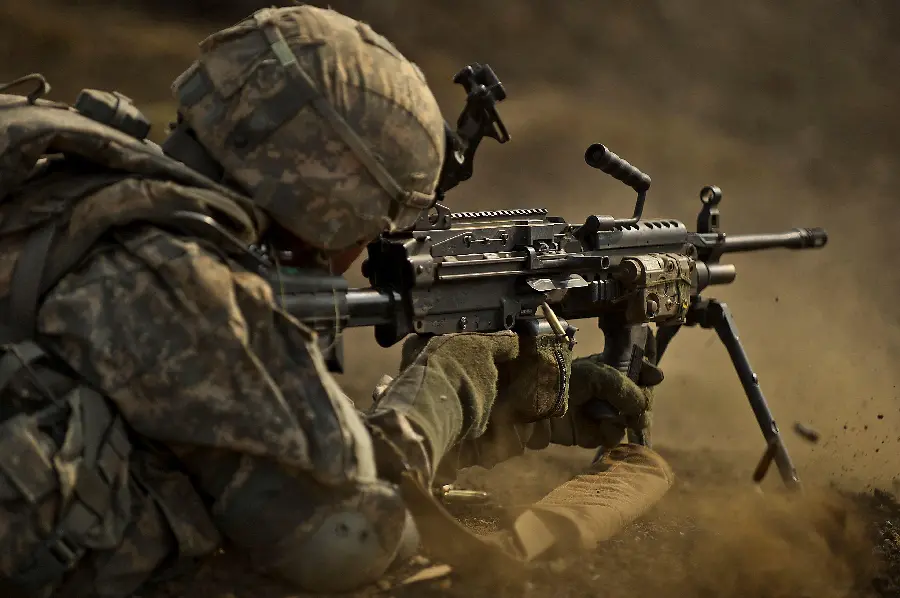 4k stock photo of a military soldier with a machine gun
