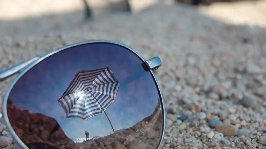 A very creative artistic photo of a couple's reflection in a pair of glasses for a background