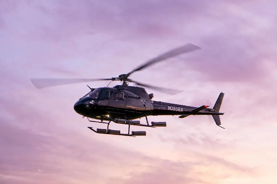 Full HD photo of a black helicopter in a pink sky, suitable for the profile of girls who love piloting