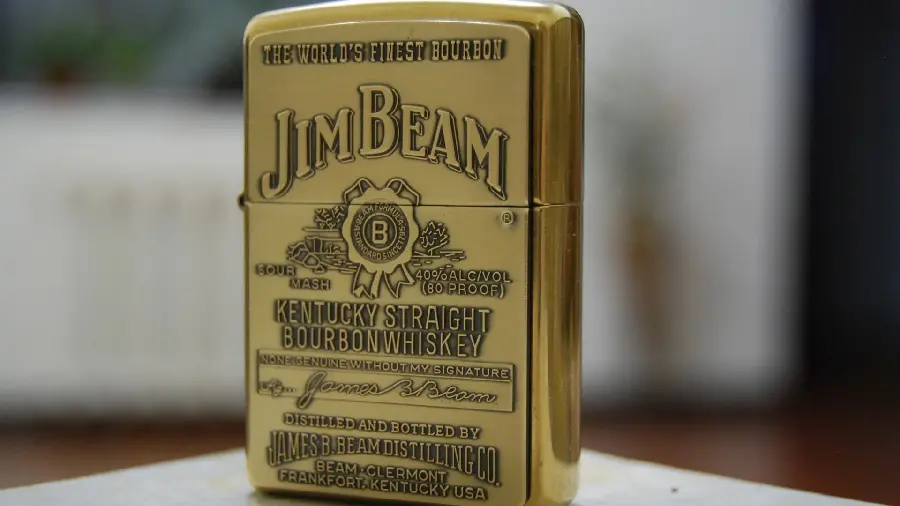 Stylish and luxurious background image of an expensive and golden Zippo lighter
