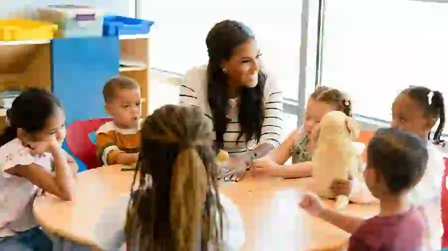 Photo of children and a teacher in a kindergarten