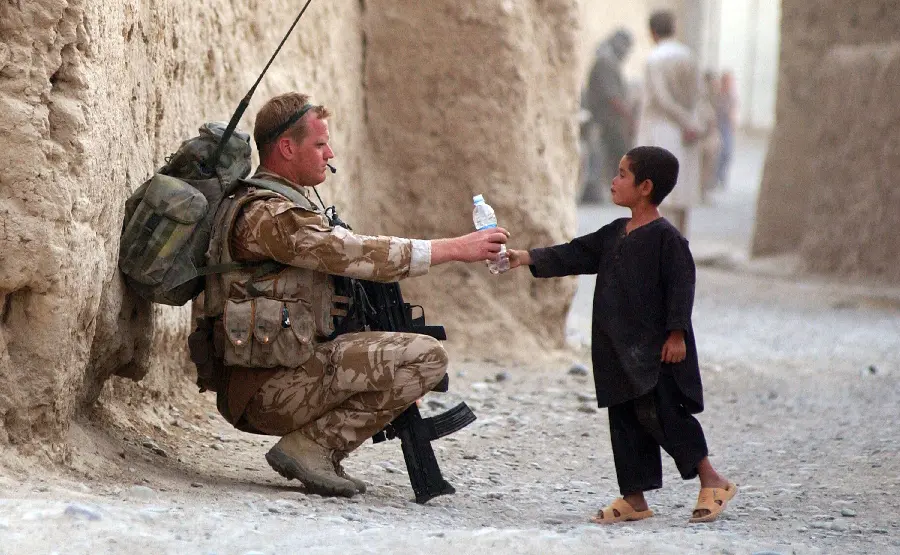 A thought-provoking photo of a child's trust in a military soldier