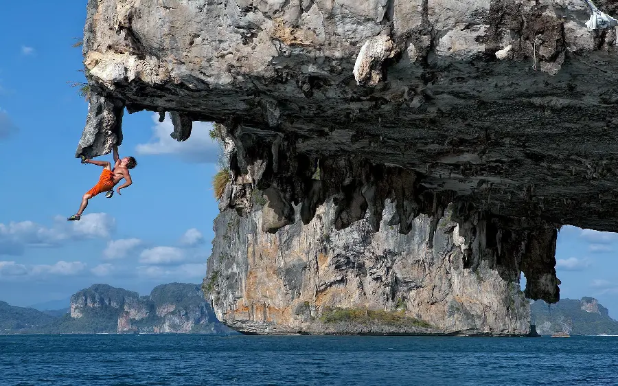 The Strangest Background of a Man Jumping Off a Giant Cliff