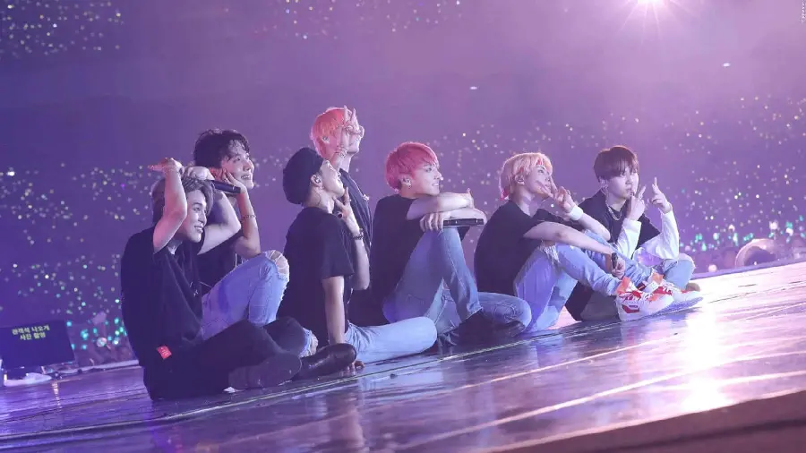 Remine's photo of BTS members at a crowded concert