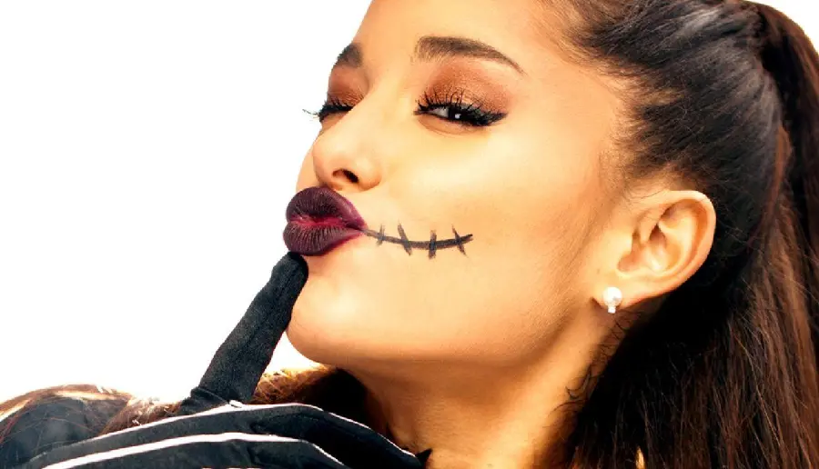 Background image of Ariana Grande, the powerful singer and actress