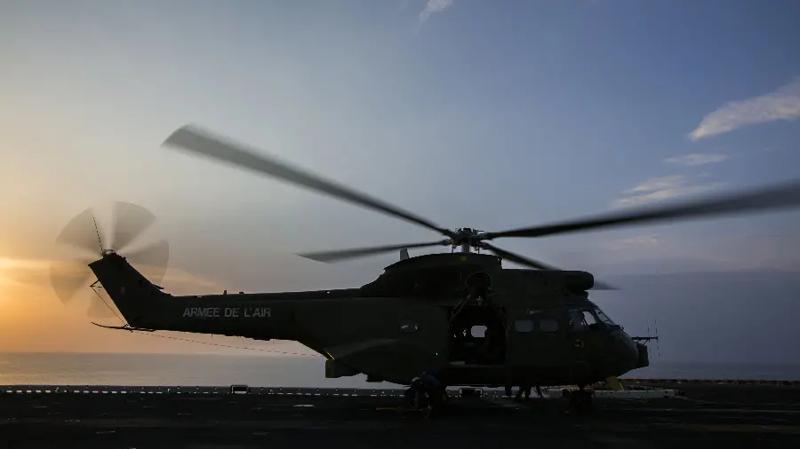 Private helicopter parked with a sunset background