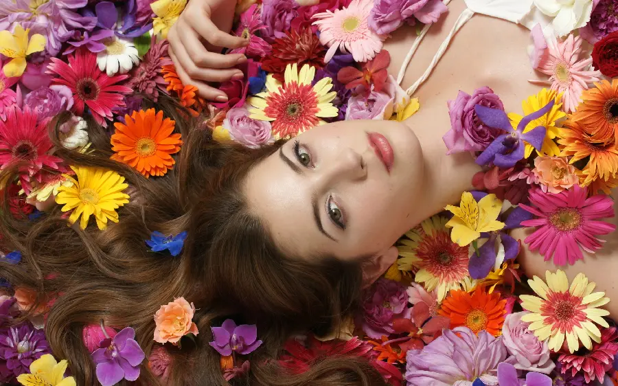 Very beautiful girl's profile picture with a colorful flower background