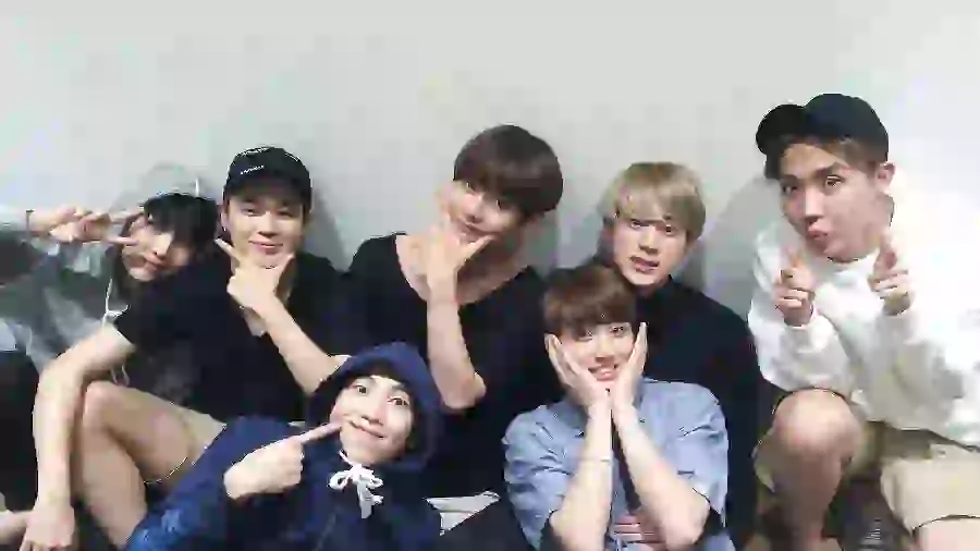 Photo of BTS members with the names Jin Suga Namjoon Jimin V Cookie and J-Hope