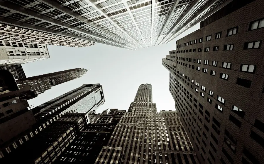 A wallpaper of tall city buildings with an interesting photographic view