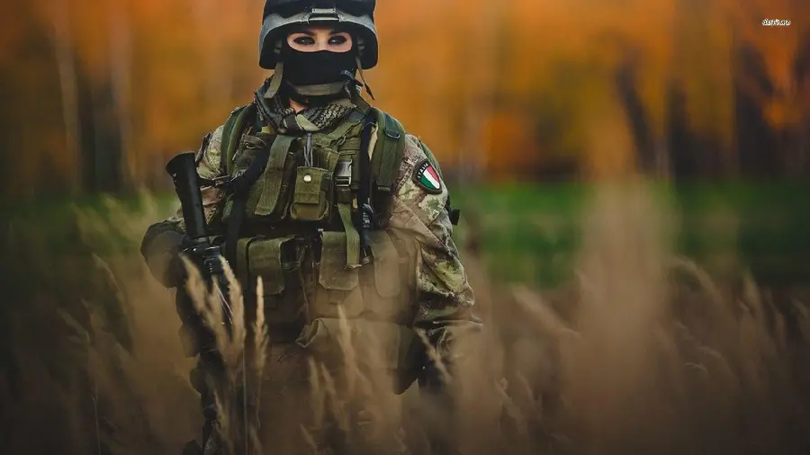 Very beautiful photo of a female soldier in the meadows