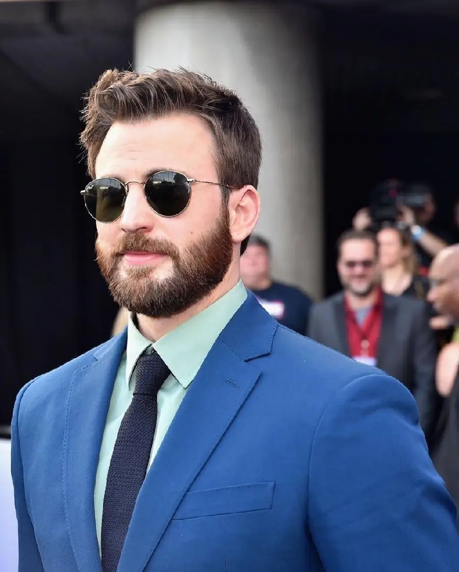 Attractive profile photo of Chris Evans with a blue suit