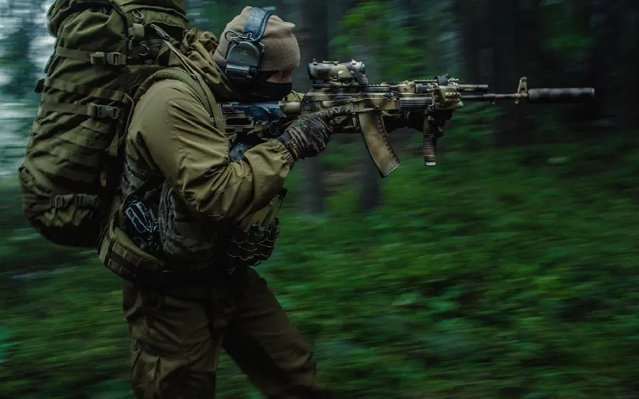 Photo taken of a military soldier moving in the forest