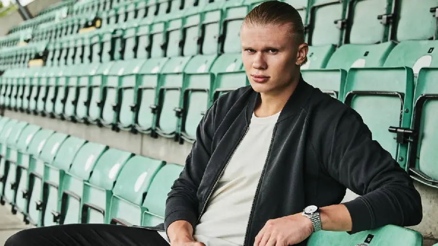 New photo of Erling Haaland, handsome and attractive, sitting on the stadium seats 