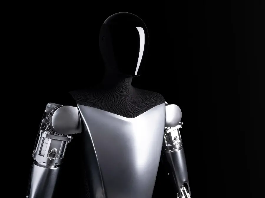 Image of the humanoid robot Optimus Tesla with a black background 