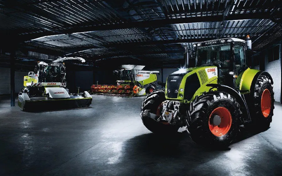Photo of new and new tractor in garage and black and dark theme