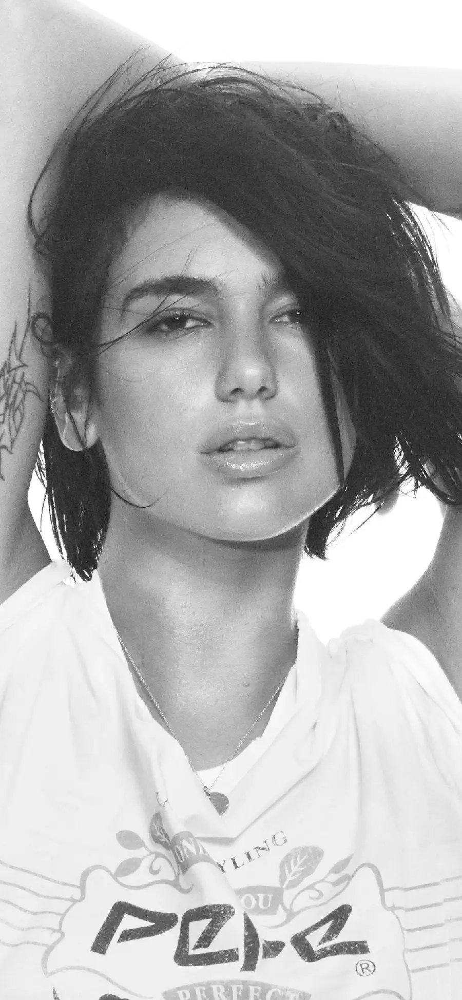 Black and white background photo of the famous face and celebrity Dua Lipa