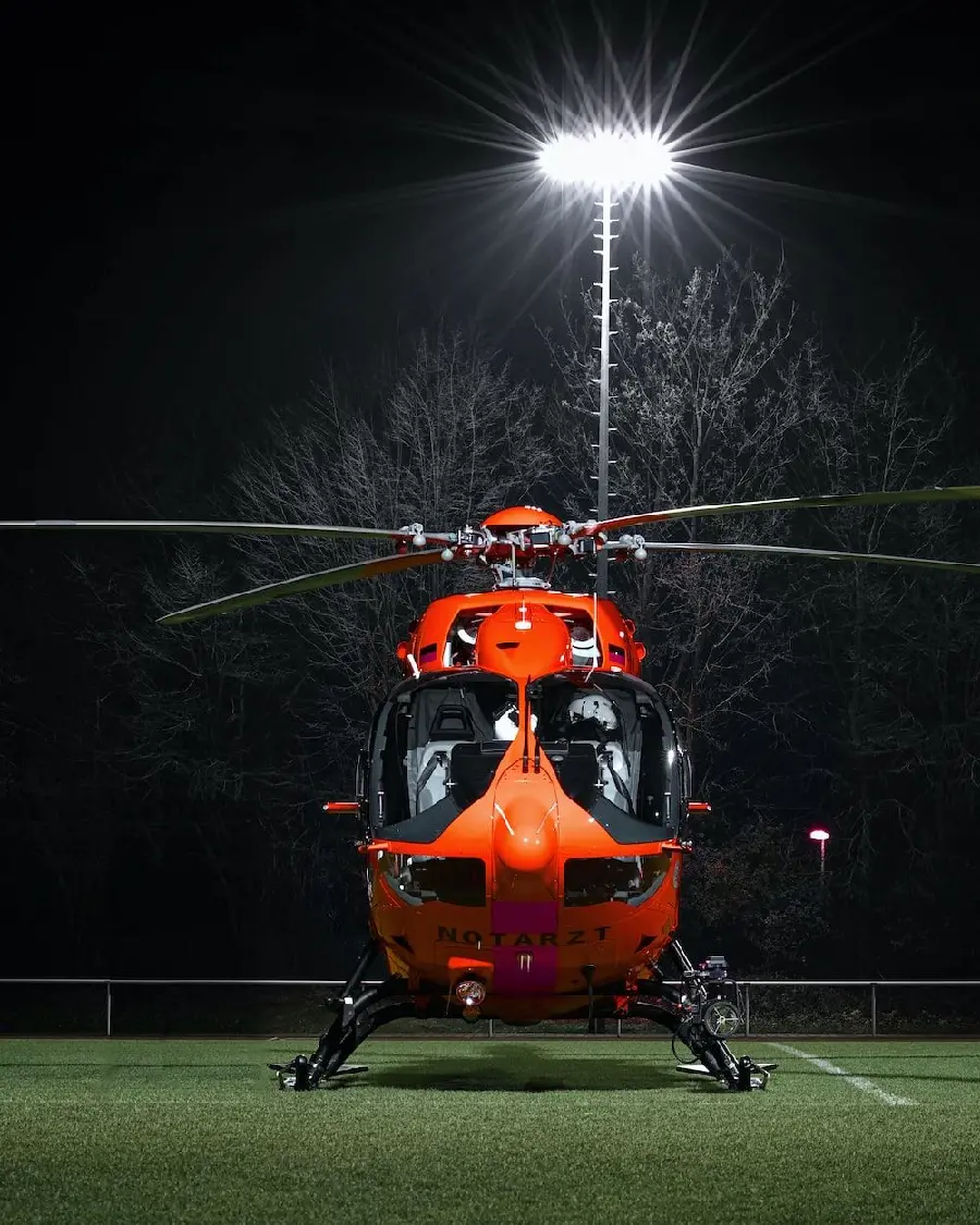 Red helicopter photo at night suitable for profile, post and story
