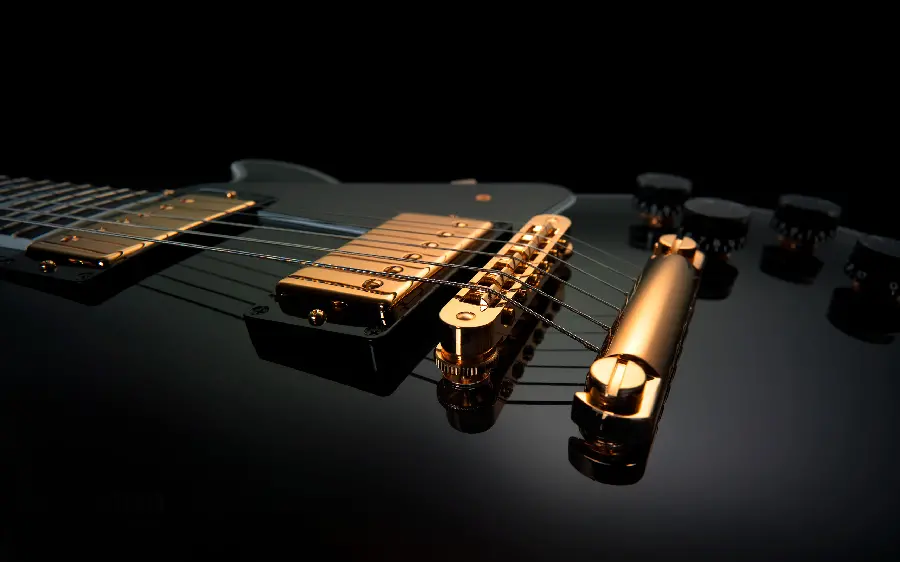 High quality background of stylish and single guitar in black gold theme