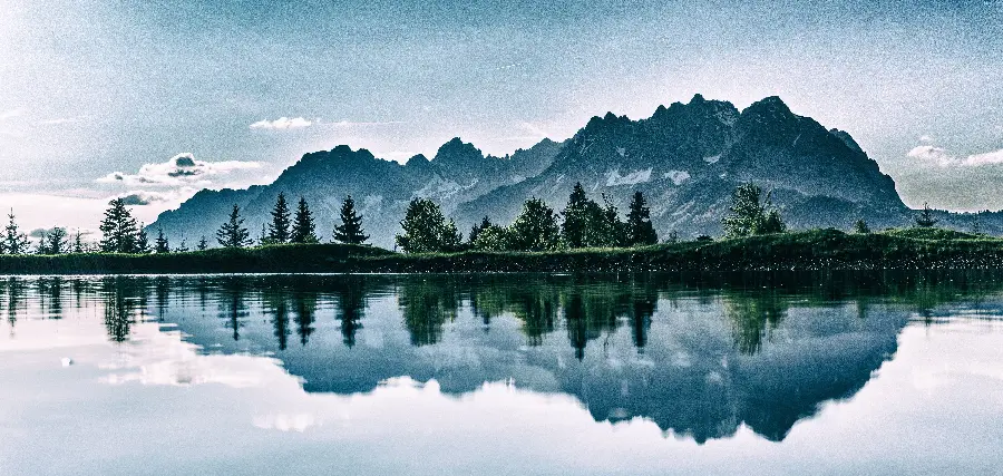 Download photo of a lake full of water in a high and beautiful mountain