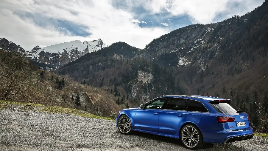 Classy and High-Model Blue Car Wallpaper in the Mountains