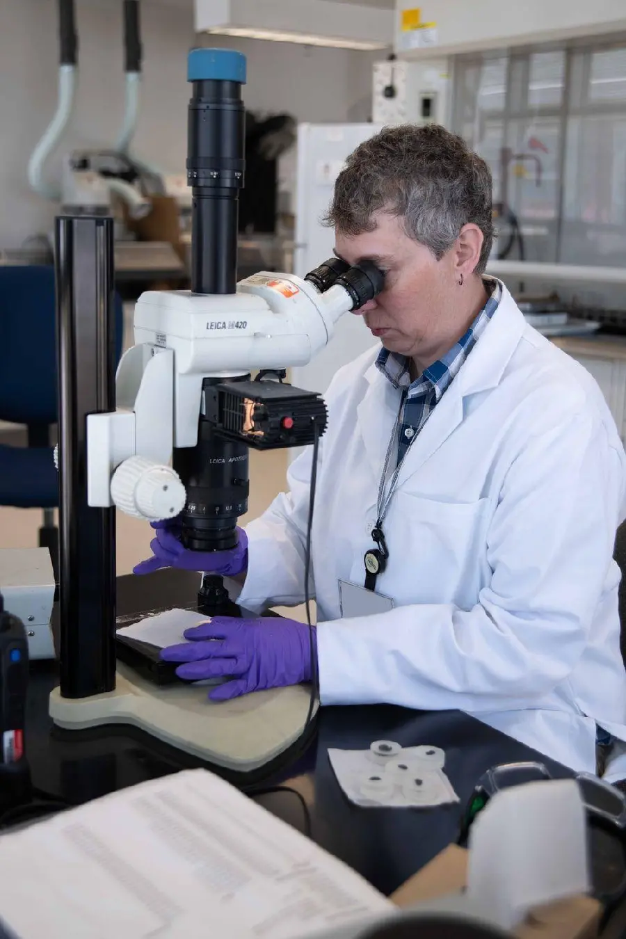 Photo of a scientist studying and reviewing work related to metallurgical science