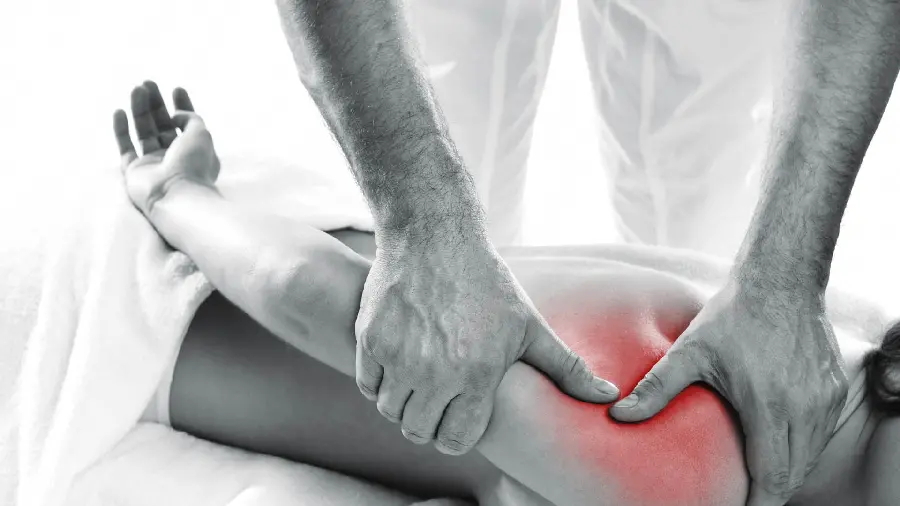 Image of a physiotherapist treating a patient with occupational therapy