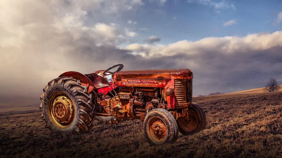 Download cartoon photo of a tractor in a farm field