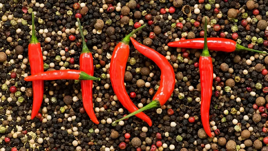 Cool wallpaper of peppers designed in the shape of the word hot