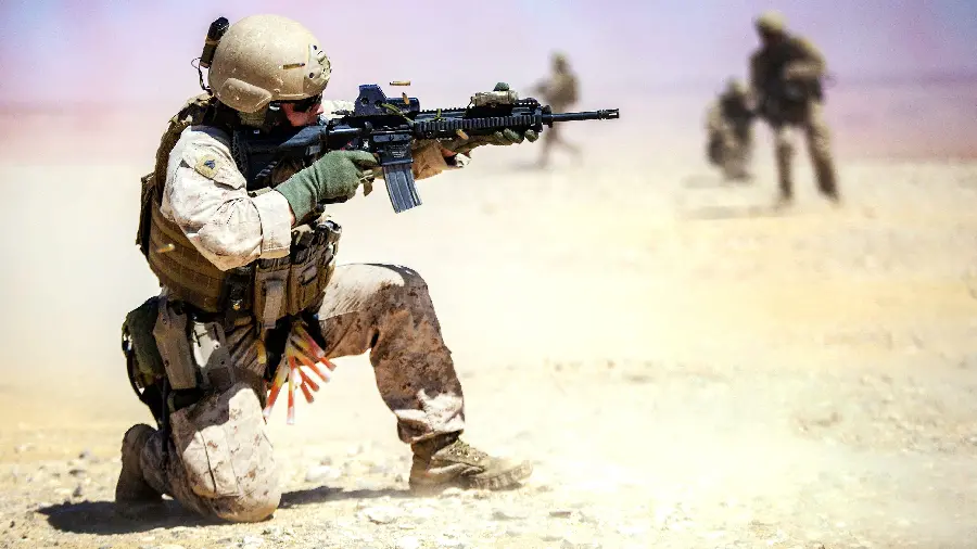 Photo of a soldier shooting at a target with an M4 carbine