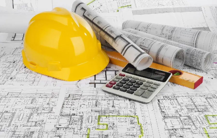 Image of building plan and tools needed to complete a construction project