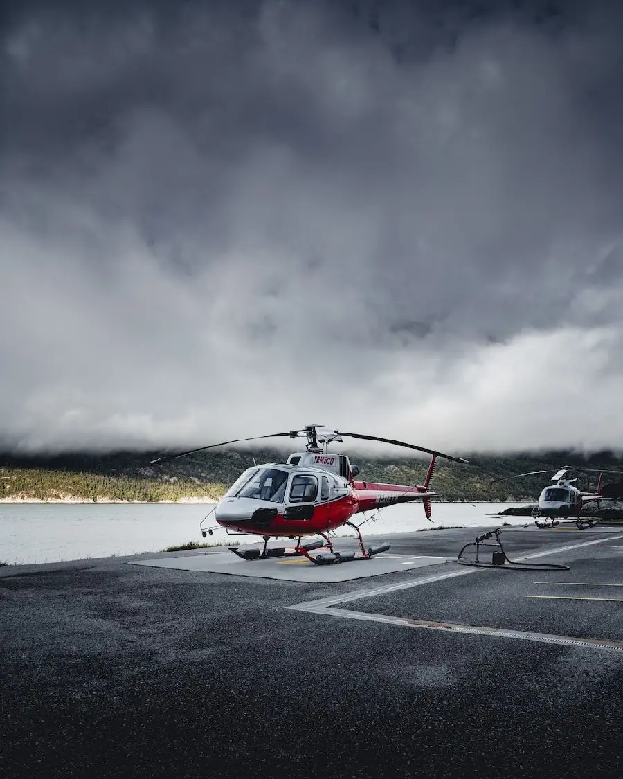 Photo of a luxury and modern helicopter with a cloudy sky background