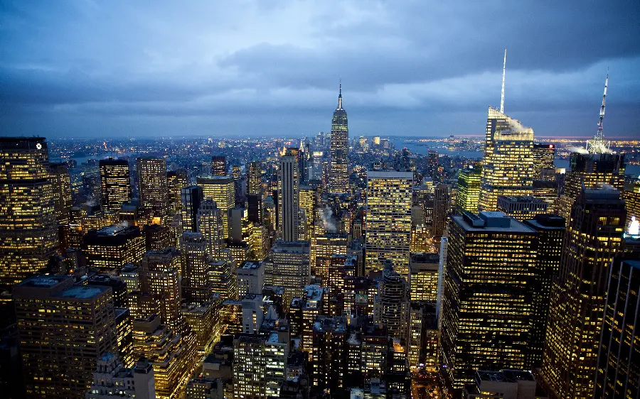 Photo of a modern city at night with bright lights 2024