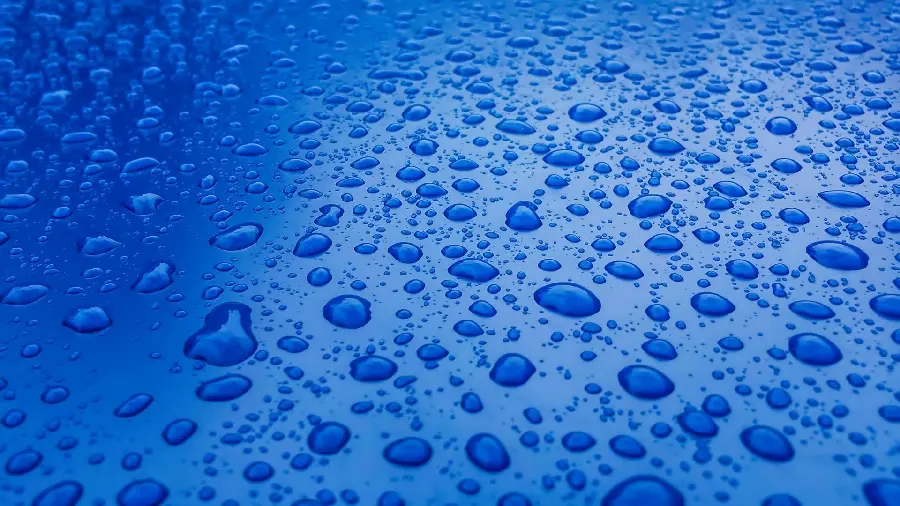 Very stylish and simple wallpaper of water droplets on a blue background