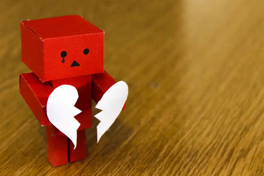 Girl's profile with a broken heart cardboard robot design
