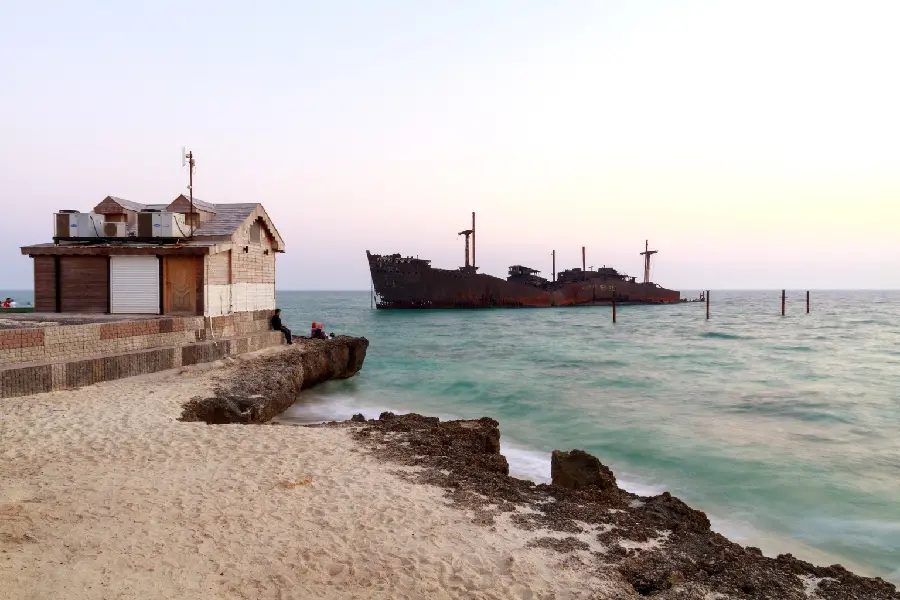 Wallpaper of an old Greek ship on the spectacular beach of Kish