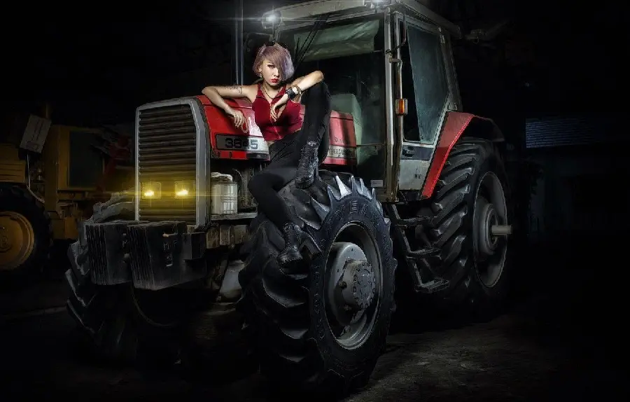 Girly wallpaper with a cartoon tractor and a beautiful young girl